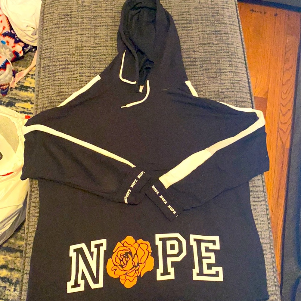 Black and white nope hoodie with small floral print specific places along w/nope
